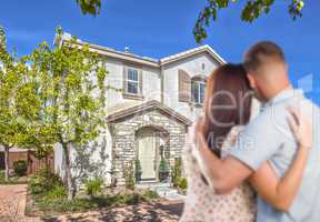 Military Couple Looking at Nice New House