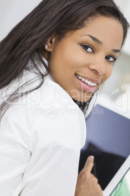 african american woman using tablet computer