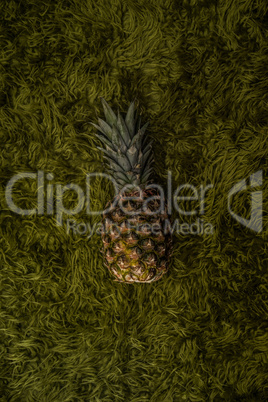 pineapple on green grass