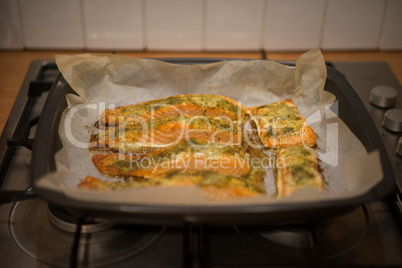 preparing baked fish in a roasting pan