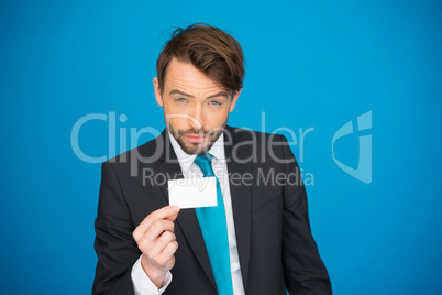 handsome businessman showing blank business card