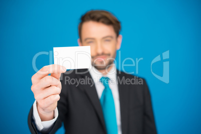 handsome businessman showing blank business card