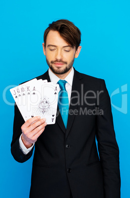 young business man showing playing cards