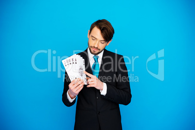 young business man showing playing cards