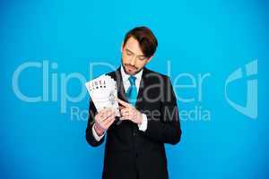 young business man showing playing cards