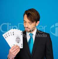 young business man showing playing cards -