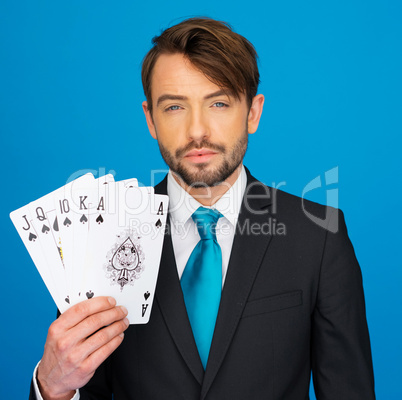 young business man showing playing cards -