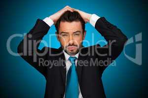 flustraded businessman on blue background ,