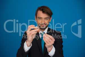 businessman topping up his e-cigarette with e-liquid