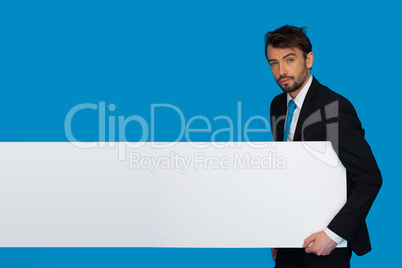 businessman holding blank poster