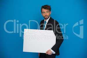businessman holding blank poster