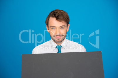 businessman holding blank poster