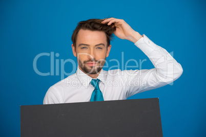 businessman holding blank poster