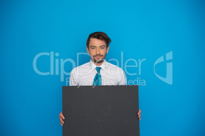 businessman holding blank poster