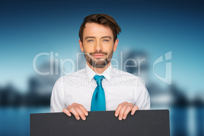 businessman holding blank poster
