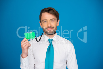 businessman holding blank businesscard