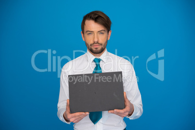 businessman holding blank poster