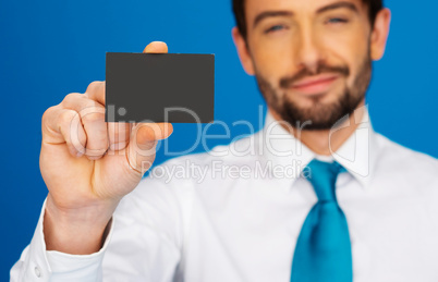 businessman holding blank businesscard