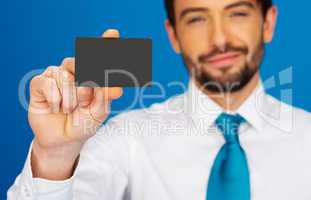 businessman holding blank businesscard