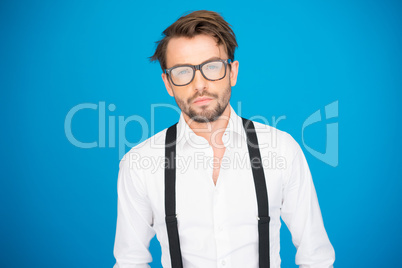 handsome man on blue wearing white shirt and braces