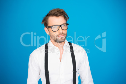 handsome man on blue wearing white shirt and braces