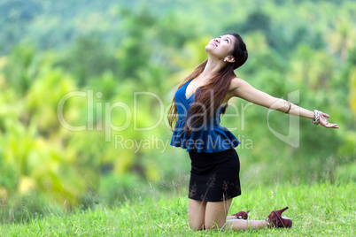 beautiful filipina woman rejoicing in nature