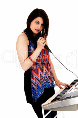 woman playing on keyboard.