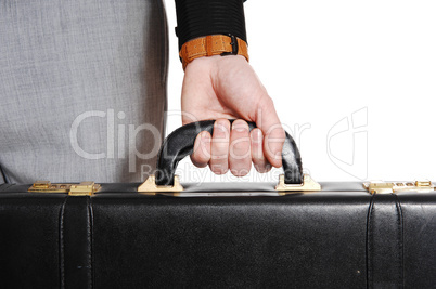 closeup of hand and briefcase.