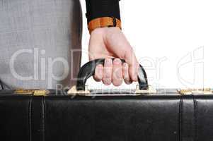closeup of hand and briefcase.