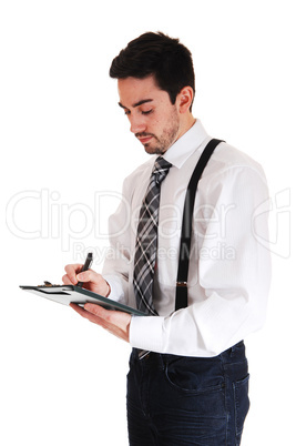 man writing on clipboard.