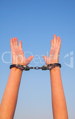 Handcuffed woman hands