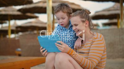 Little boy with is mother at a beach resort