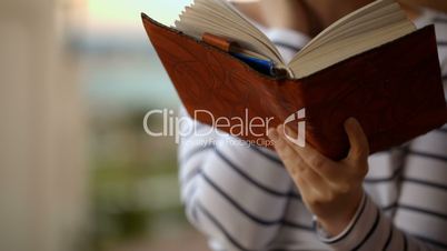 Day-dreamer with book in hands