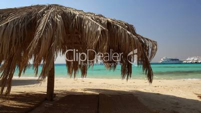 Straw beach umbrellas at a tropical resort