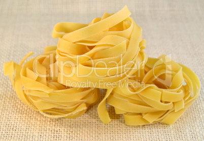 Tagliatelli italian pasta on a table