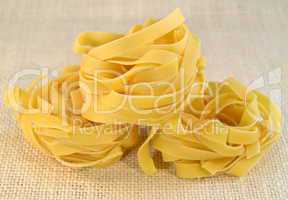 Tagliatelli italian pasta on a table