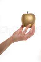female hand holding a gold apple
