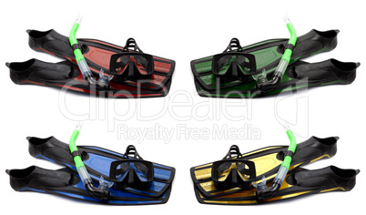 set of multicolored flippers, mask and snorkel with water drops