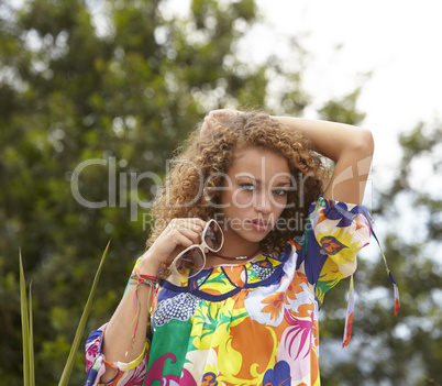 beautiful woman with curly hair and sunglasses