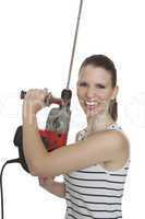 young craftswoman with a power drill