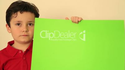 Child Holding Onto A Green Screen