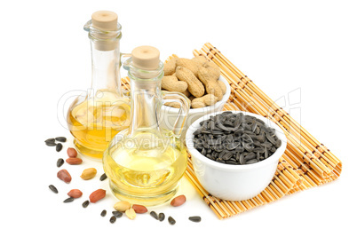 sunflower seeds, peanuts and bottle of oil