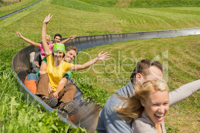 excited couples enjoying alpine coaster luge