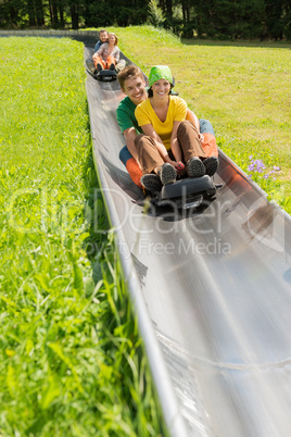 happy couples enjoying alpine coaster luge