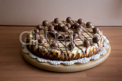 tasty tart topped with chocolate balls in a heart
