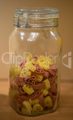 dried heart-shaped pasta in a storage jar