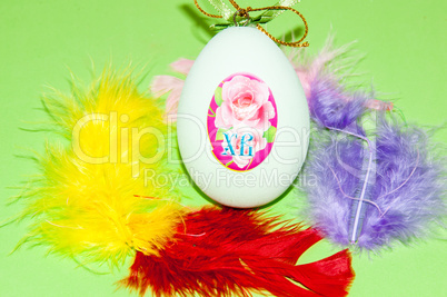 Easter egg and bird feathers