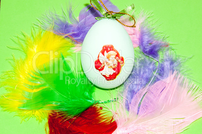 Easter egg and bird feathers