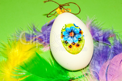 Easter egg and bird feathers