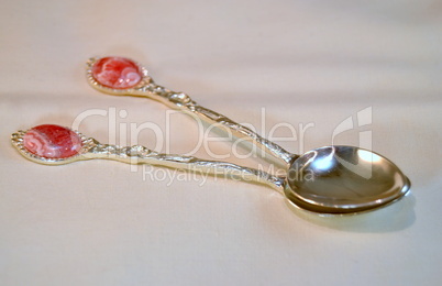 Ornate silver spoons with  pink rhodochrosite stone